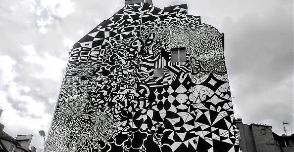 Mural przy ul. Woźnej wykonany przez holenderskiego artystę Erosie z festiwalu Outer Spaces